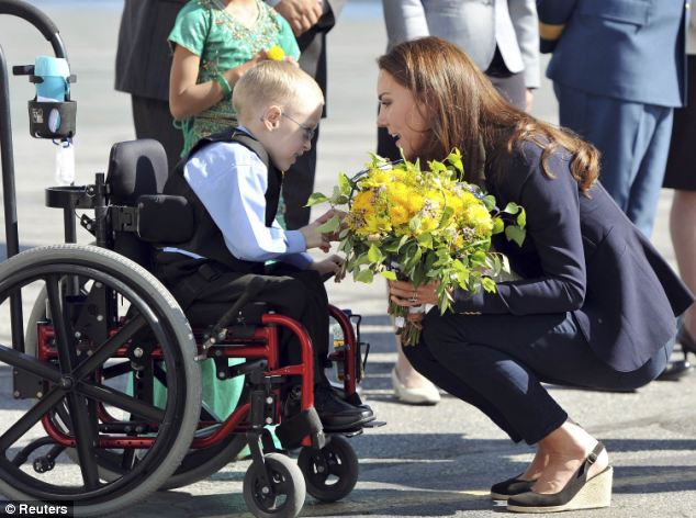 Kate meeting wheelchair-bound Riley Oldford, 6, at Yellowknife airport during 2011's Canadian tour