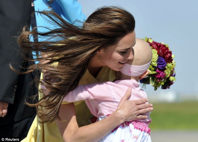 Kate with 6-year-old Diamond Marshall in Calgary in 2011, as she toured Canada with Prince William