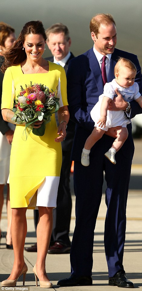 Stunning: Kate admired her posy of flowers which were presented by Joscelyn Sweeney, 22, who has Down's Syndrome