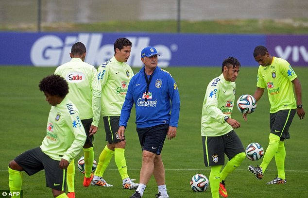 Likes what he sees? Brazil boss Luiz Felipe Scolari (centre) casts his eye over his squad