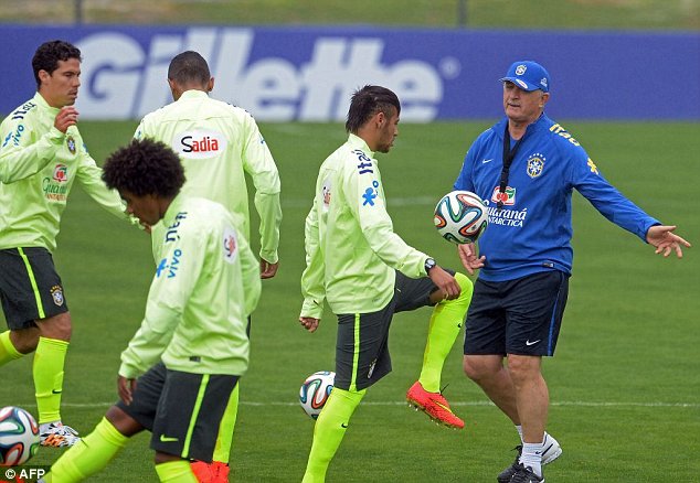 Orders: Scolari gives instructions to Neymar as the Samba stars build up towards the World Cup 