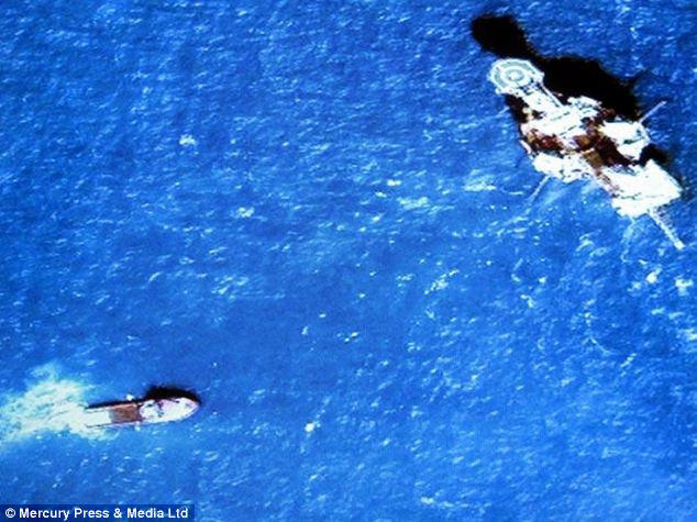 A boat and oil rig are pictured where Mr Akers believes NASA pictures showed debris of the plane