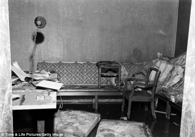 A ripped, blood stained and burnt sofa inside the bunker - which was located under the Reichschancellery building in the heart of Berlin. Hitler lived in the Führerbunker with Braun for the last months of the war