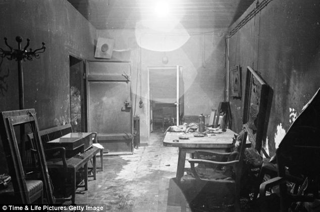 These extraordinary pictures reveal inside Hitler's bunker. This room is thought to have been the Fuhrer's command center conference room - which was partially burned out by SS troops and stripped of evidence by invading Russians in 1945