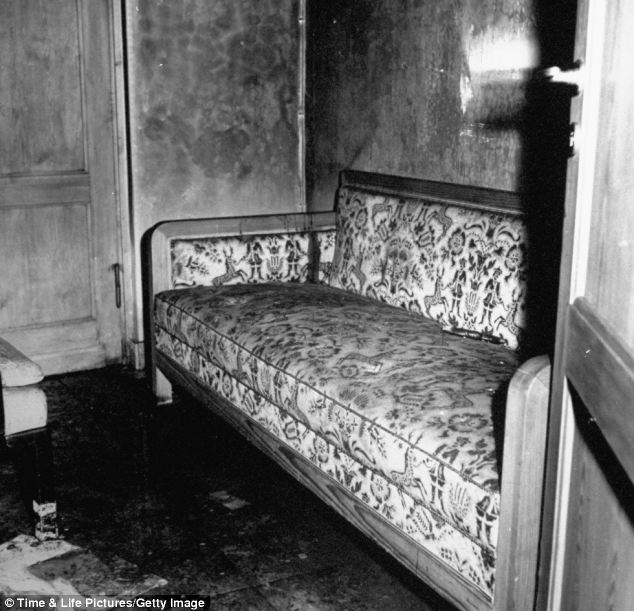 Another picture of the sofa in the dim and grotty room of the bunker