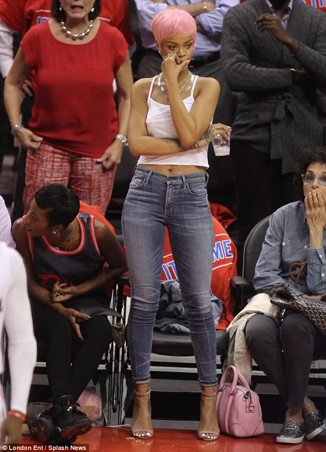 Go team! The songstress looks pensive as she watches the Los Angeles Clippers lose on Thursday