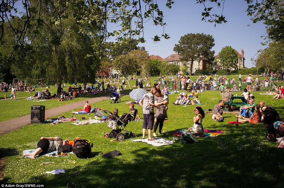 Busy: People enjoy the hot weather at St Andrews Park in Bristol, as temperatures remain high across Britain