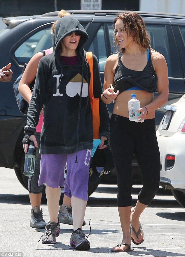 Hard at work: Madonna was seen exiting the West Hollywood branch of the popular spinning studio with some of her backup dancers