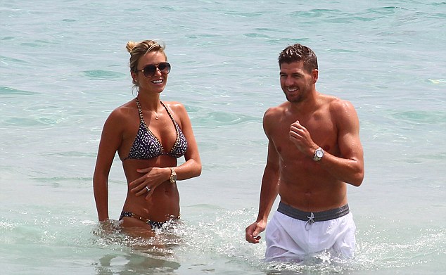 Have you heard that one about Suarez? Gerrard jokes around in the water