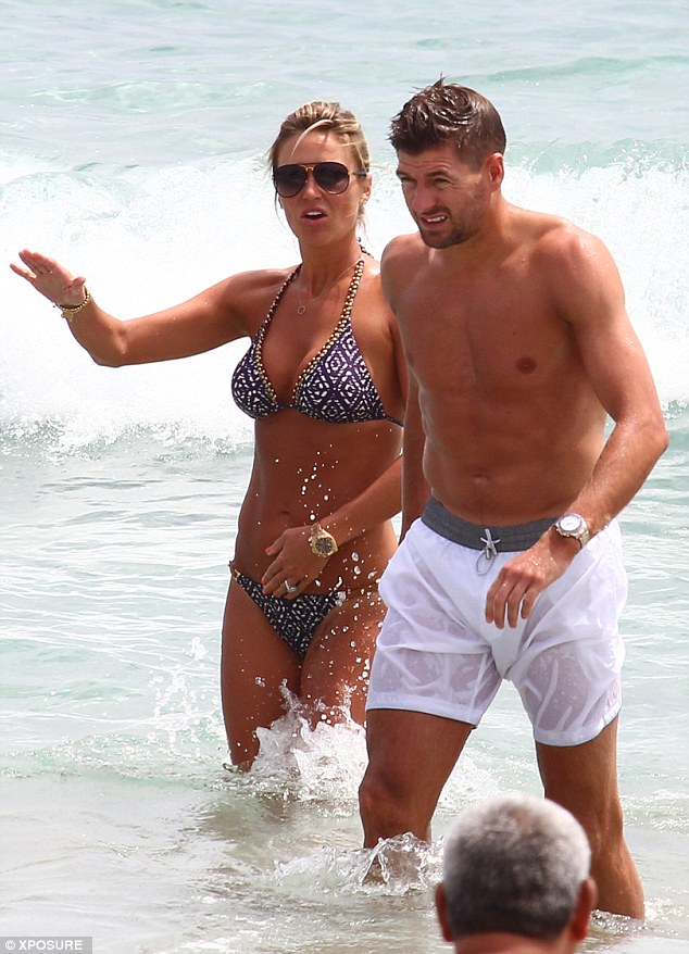 Hard bodies: The married couple showed off their equally toned physiques on the beach