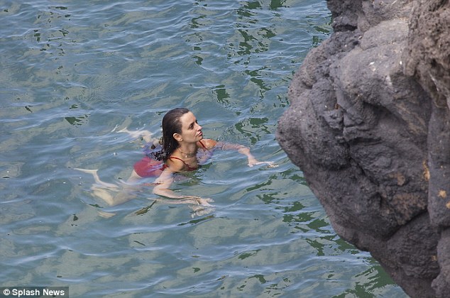 What's that? Penelope appeared to spy something on an overhanging rock during her dip