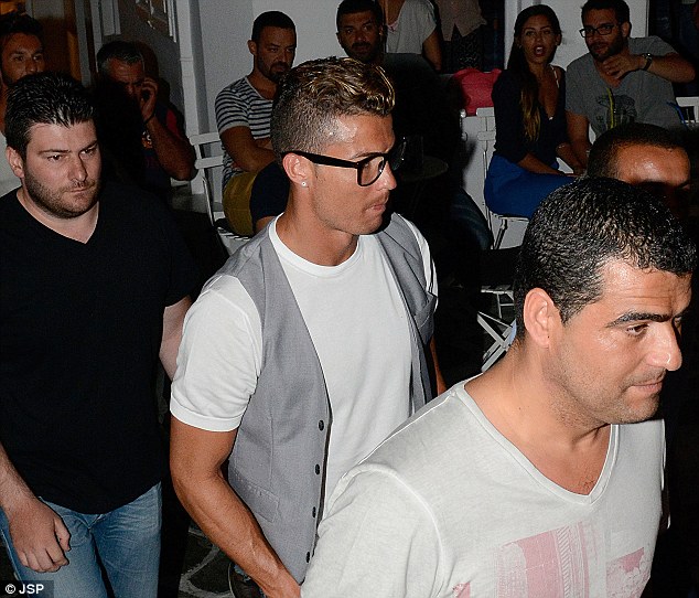 Low key: It was a pretty relaxed evening for the Portuguese forward as he wandered the streets