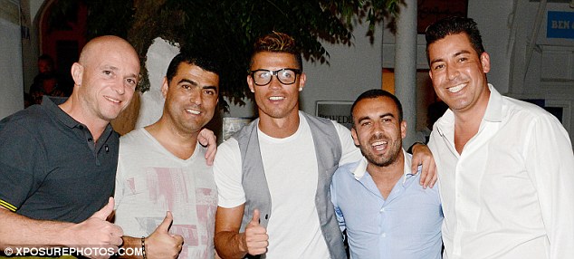 Not bothered: Ronaldo looked happy to be around friends after Portugal's World Cup exit
