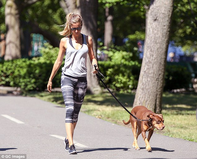No fanfare: Apart from her obvious amazing genetics, the star could have passed for any other regular civilian as she enjoyed her no-fuss stroll with her gorgeous pup, who was the best bodyguard she could ask for