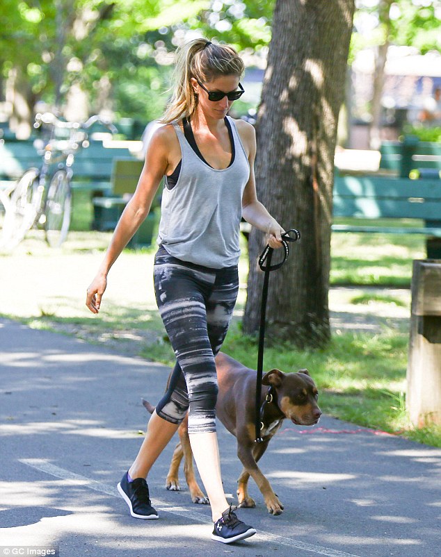 Incidental exercise: The 33-year-old displayed her long, lean legs in a pair of grey patterned three-quarter leggings as she got in an easygoing workout on the beautiful summer's day