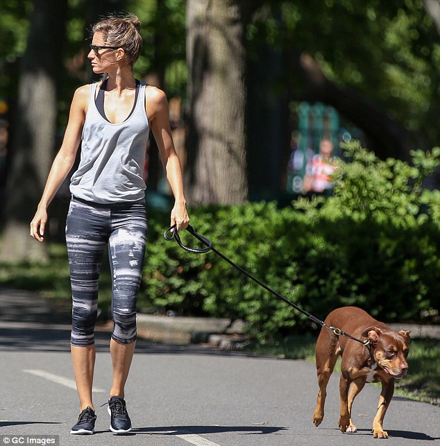 Showing her team spirit: The previous day, the world's highest-paid supermodel was wearing a much brighter outfit as she got dressed up in her native Brazil's yellow and green football jersey as she cheered her home team on to victory against Colombia in the FIFA World Cup quarter-finals