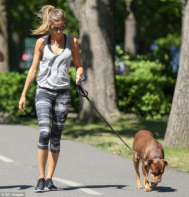 Natural beauty: Gisele wore not a lick of make-up on her already flawless complexion, while she wore her long blonde locks pulled back from her face in a high loose ponytail