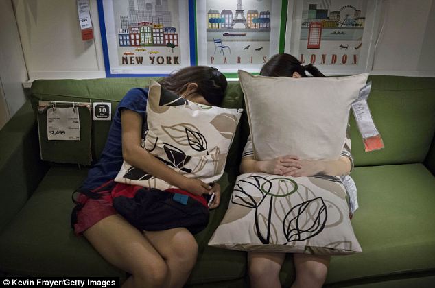 Cushion cuddlers: Many Chinese cannot yet afford the luxuries of IKEA furniture, but they hope to soon
