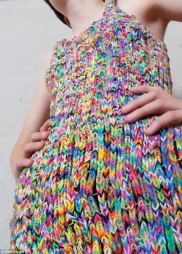 Intricate: Mrs Burnand made the dress from 24,000 of the multicoloured bands, taking three-and-half-weeks to sew them together into a size 4 dress