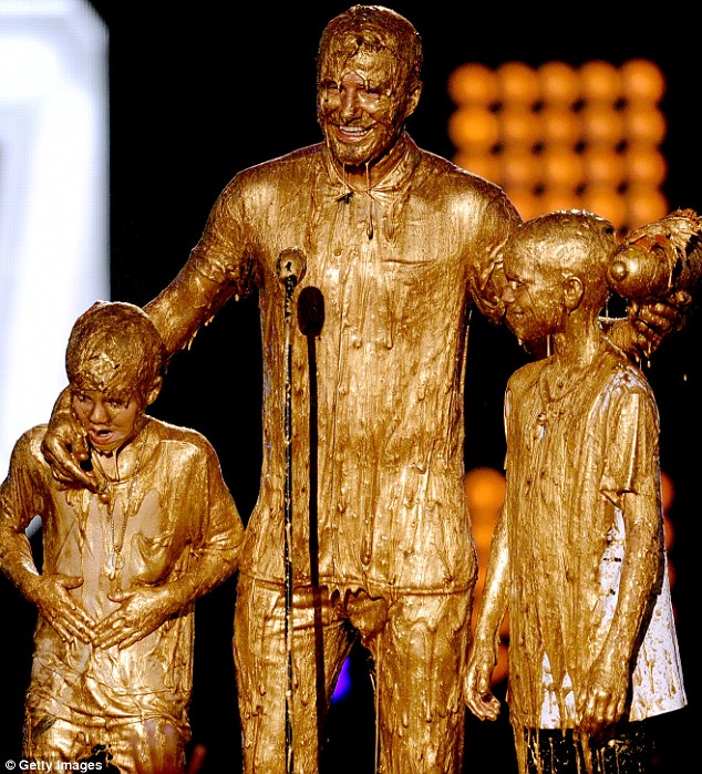 Forget Goldenballs: David Beckham and his boys were dripping in golden goo at the Nickelodeon Kids' Choice Sports Awards in Los Angeles on Thursday