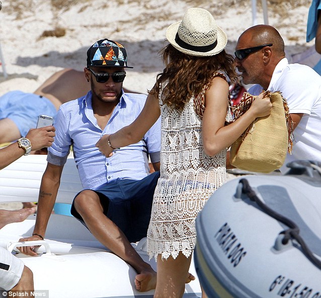 Disembarking: Neymar climbing out of the boat