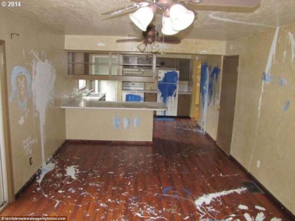 Tasteful décor? We've all heard of adding a splash of paint, but the owners of this home may have got a little carried away. The fridge, walls, wooden floor and surfaces are all victims of a bad paint-job
