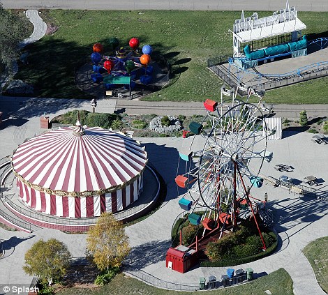 Heyday: Neverland seen here back in 1995 and, right, Michael with his then-wife Lisa Marie Presley hosting an event with children at the ranch in the same year