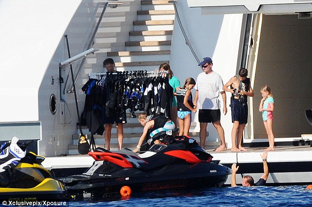 Adventure: The Gates family get ready to jet ski aboard the $5million-a-week superyacht The Serene which the billionaire is renting from the owner of the Stolichnaya vodka brand