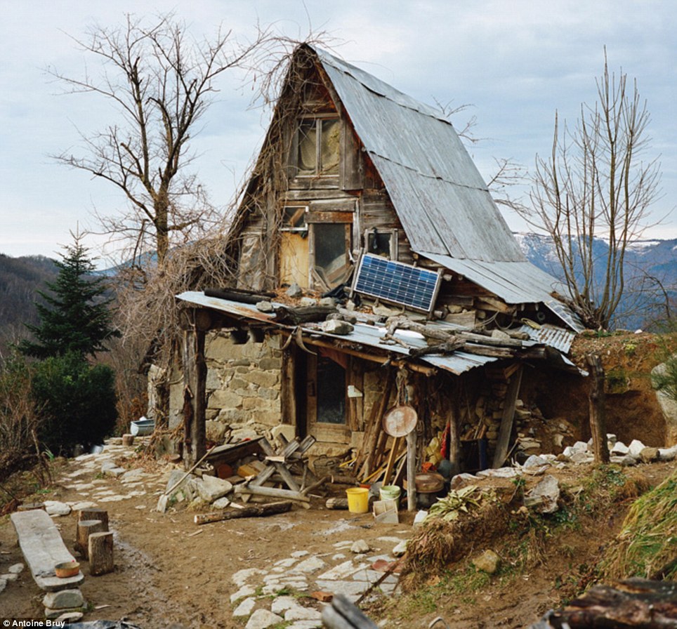 At one with nature: French photographer Antoine Bruy travelled around Europe living with families who have turned their backs on modern civilization for a humble existence deep in the wilderness. This ramshackle house in Ramounat in The Pyrenees belongs to a German man called Peter who has lived there for the last 30 years. He moved to the area with his wife and children, but they left decades ago, it was reported by Feature Shoot