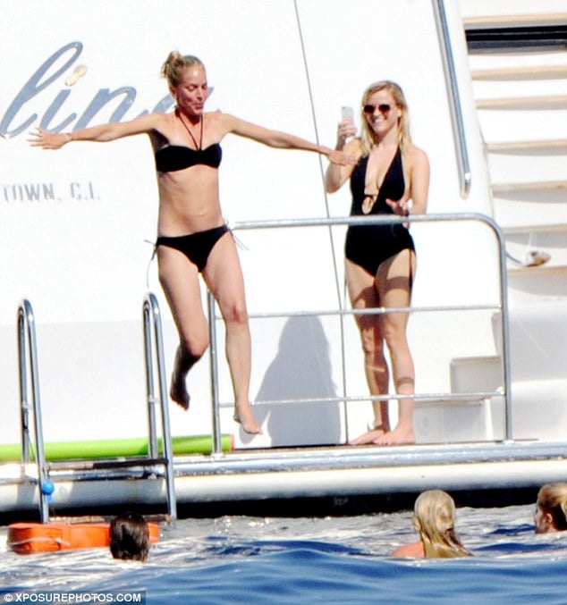 Diving in! Reese was on snapping duties as her girlfriends jumped into the sea in Capri
