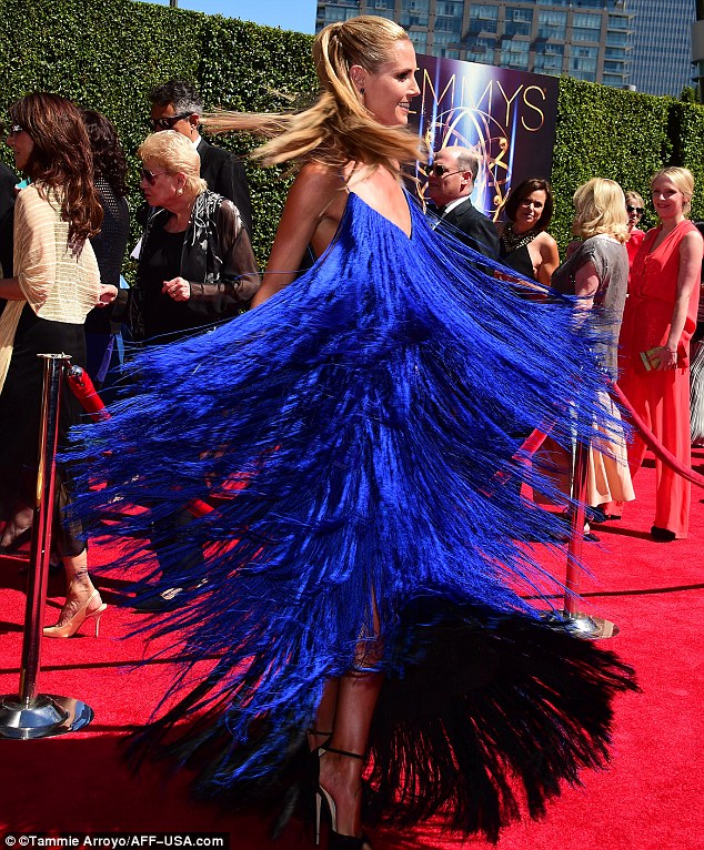 Stunner: The German born super model did look spectacular in the brightly shaded dress