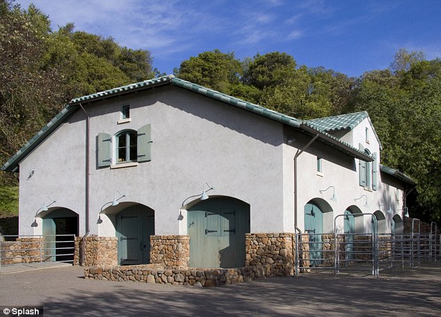 Real ranch: Also contained within the grounds is a seven-stall horse barn (pictured), tennis court, hiking and riding trails, a spring-fed pond, and, more than 100 olive trees which produces gallons of olive oil every year