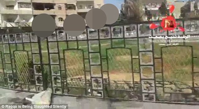 Heads impaled on spikes look down on the city's pavements in a constant reminder of the group's barbarity 