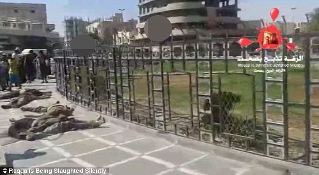 By-passers do not raise an eyebrow at the horrific scenes with ISIS fighters patrolling the city's streets 