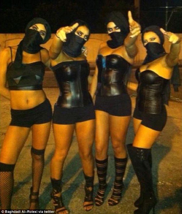 Femme fatales: Four women dress up in female versions of Islamic State attire while pulling gun poses