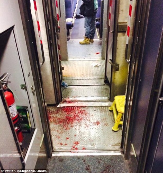 Scene: A man has been arrested after allegedly stabbing multiple people on an Amtrak train in Niles, Michigan on Friday evening. Above, blood is spattered across the floor of the train after the stabbing