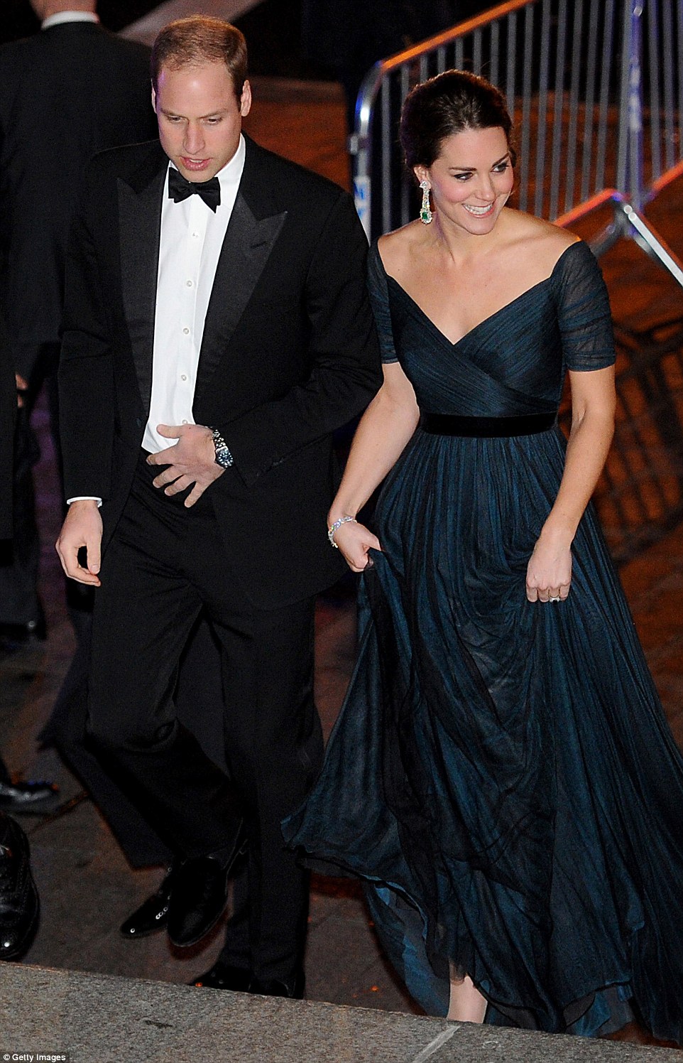 Dazzling: The Duke and Duchess are pictured arriving at New York's Metropolitan Museum of Art tonight to raise money for their alma mater: St Andrews University in Scotland. Kate is seen donning a midnight blue Jenny Packham evening gown and designer earrings