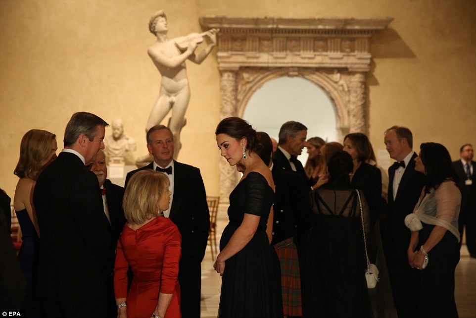 Expecting: The Duchess's five-month baby bump was on show as she spoke to guests prior to the 600th anniversary gala dinner