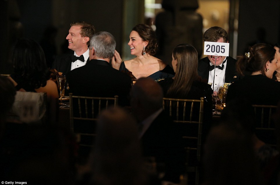 Laughing: The Duchess laughs as she raises money for St Andrews, where she met and fell in love with her royal husband, William