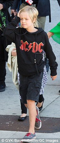 Confident: The self-possessed girl developed her unique, androgynous style early on and it reportedly confused her conservative Republican grandmother Jane Pitt (pictured November 21 & February 5)