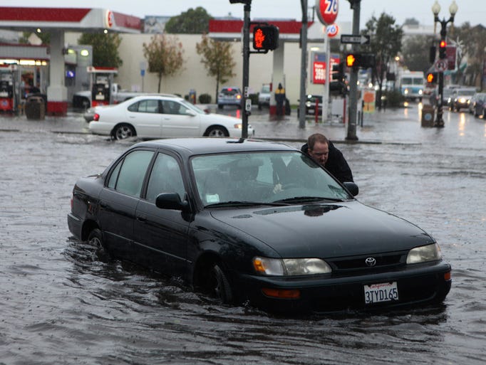 Mark Kunze of San Bruno pushes his stalled vehicle