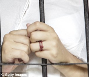 The 19-year-old had a red string tied around her engagement ring finger as she waited behind bars on Wednesday. Mack will stand trial for her mother's murder alongside lover Tommy Schaefer