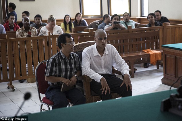 Accused murderer Tommy Schaefer, 21, listened in on proceedings sitting next to his translator at the court in Denpasar, Bali