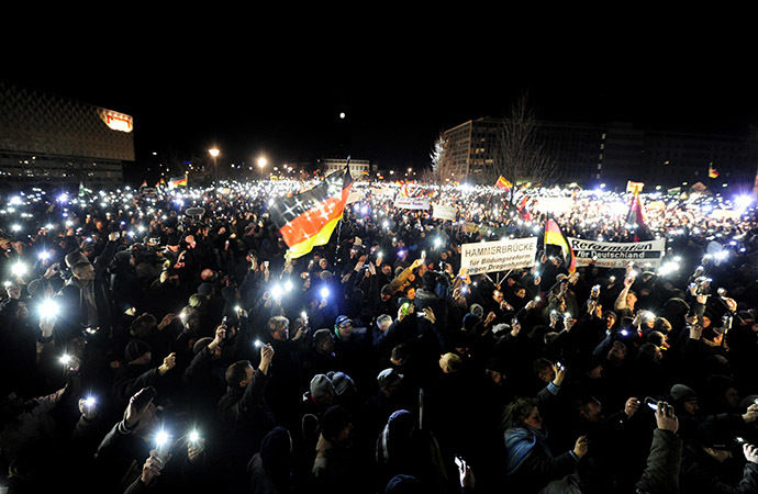 Sympathizers of German right-wing populist movement PEGIDA (Patriotic Europeans Against the Islamisation of the Occident) attend their twelfth march in Dresden, eastern Germany on January 12, 2015. (AFP Photo/Robert Michael)
