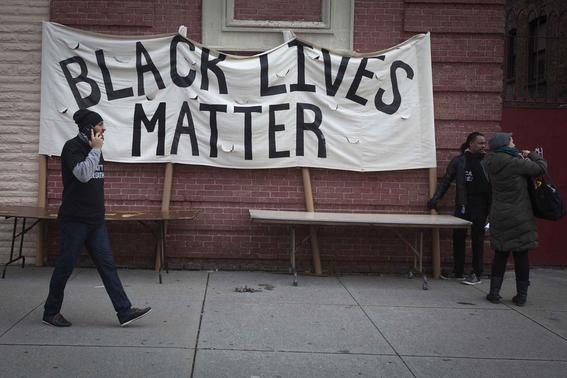People attend a Martin Luther King day rally in the Harlem section of New York January 19, 2015.   REUTERS-Carlo Allegri