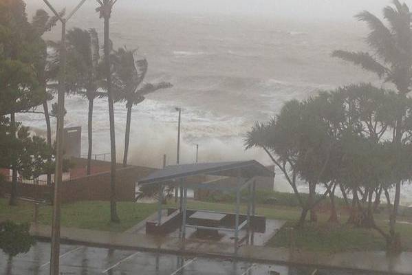 Waves break over the sea wall at Yeppoon on Friday.