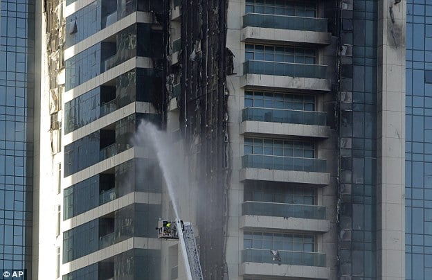 Blaze: In November 2012 (pictured) , experts blamed the same external coating for the inferno that engulfed another luxury Dubai development known as the Jumeirah Lake Towers (JLT)