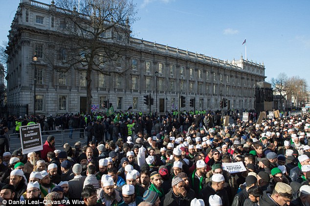 Thousands of British Muslims gathered outside Downing Street today to protest against Charlie Hebdo's publication of cartoons of the Prophet Mohammed