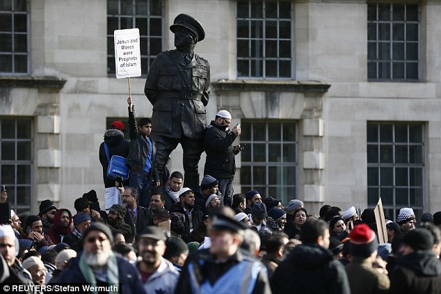 Muslims scaled the statue of Viscount Alanbrooke, a Second World War Army commander, during the protest in central London