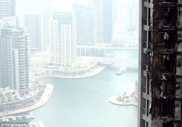 Beacon: Dozens of stories in the 86-storey Torch skyscraper left several apartments severely damaged